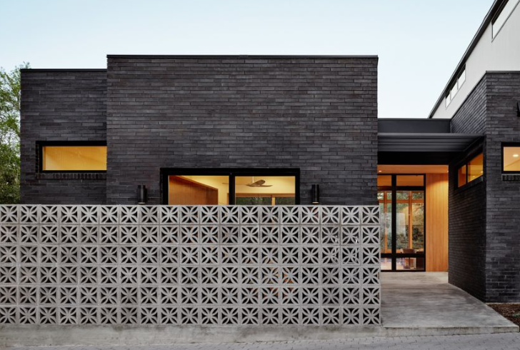 The allure of a black brick house lies in its striking aesthetic appeal.
